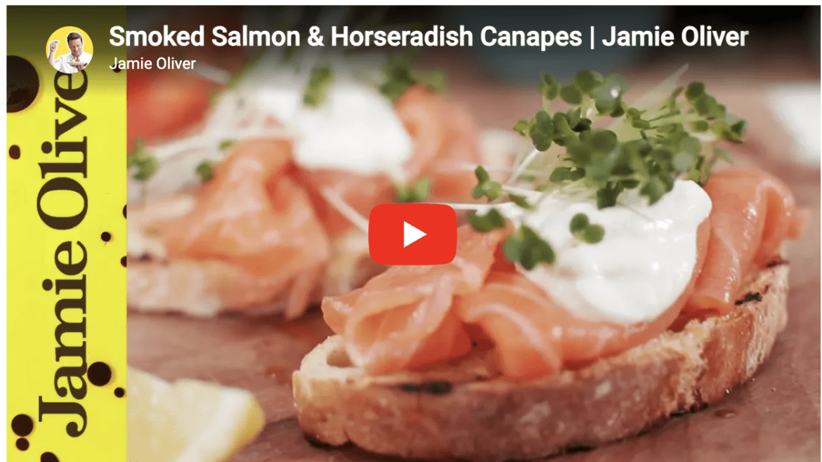 Smoked salmon and horseradish canapés served on toasted bread, from a Jamie Oliver recipe video.
